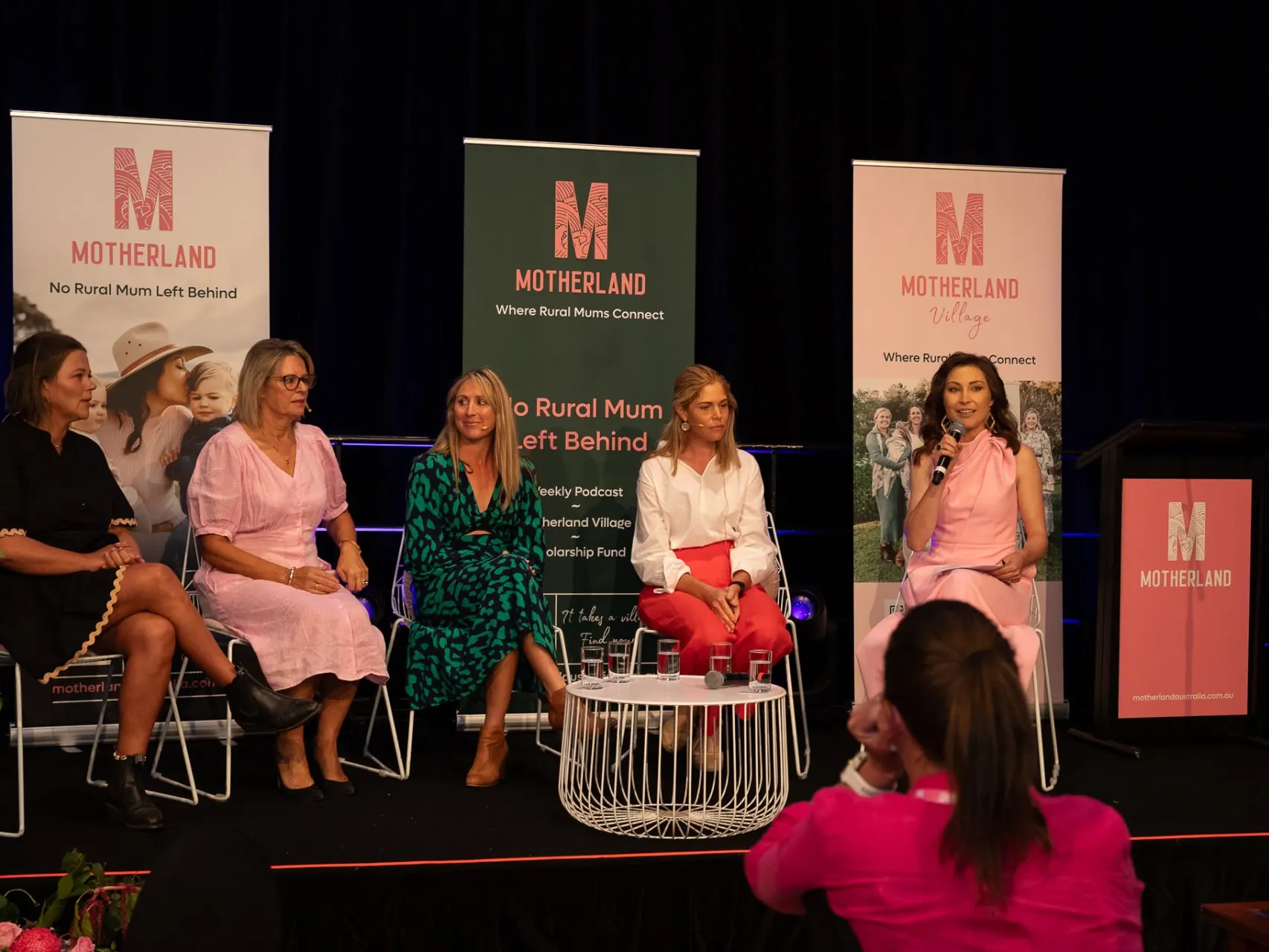 A panel of rural mums on stage at a Motherland event