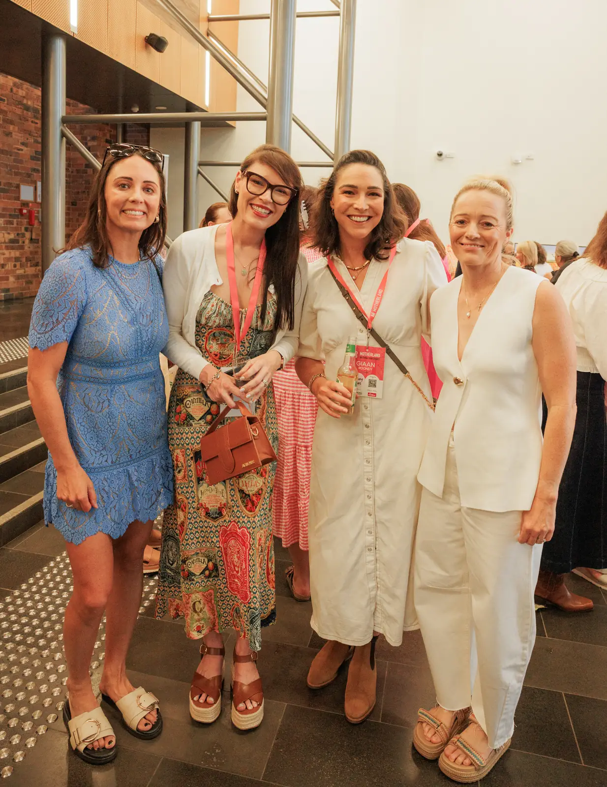 Four mums catching up between sessions