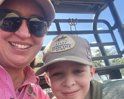 Kristie Bargenquast smiling with her son Mitchell and their dog