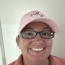 A Motherland Village mum in her pink cap